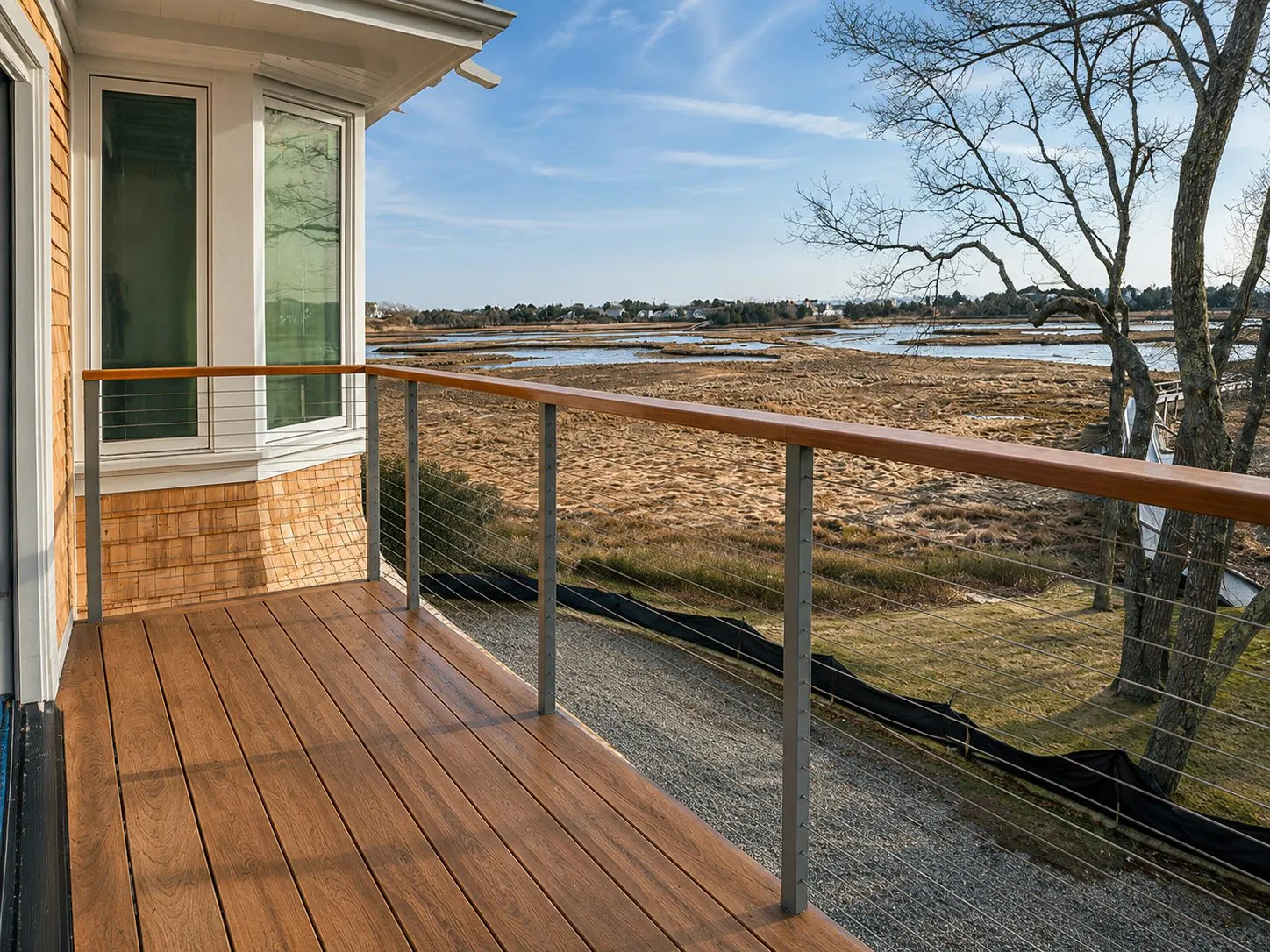 Cable-rail deck built by Redline overlooking a Cape Cod salt marsh
