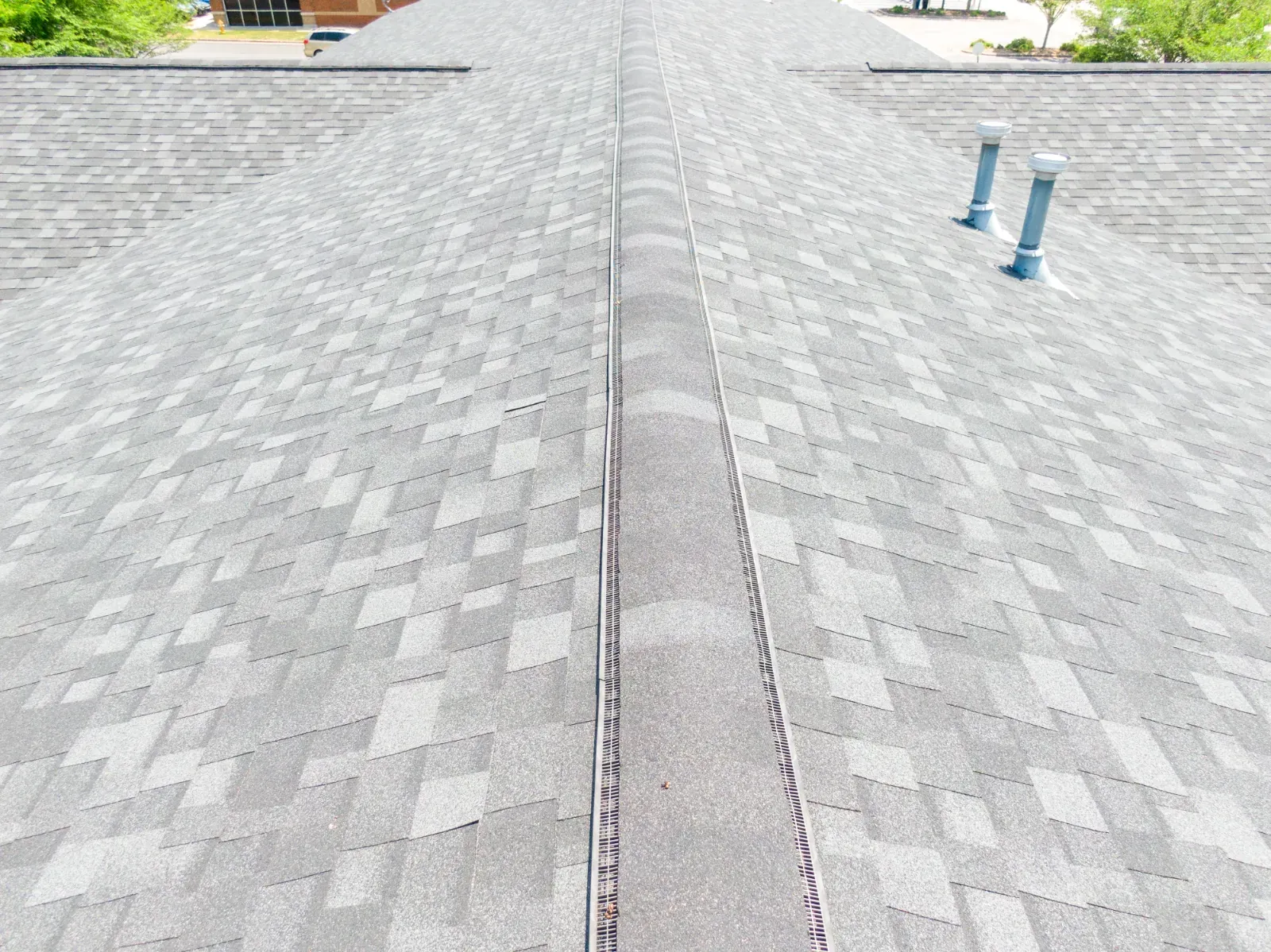 Gray asphalt roof ridge line