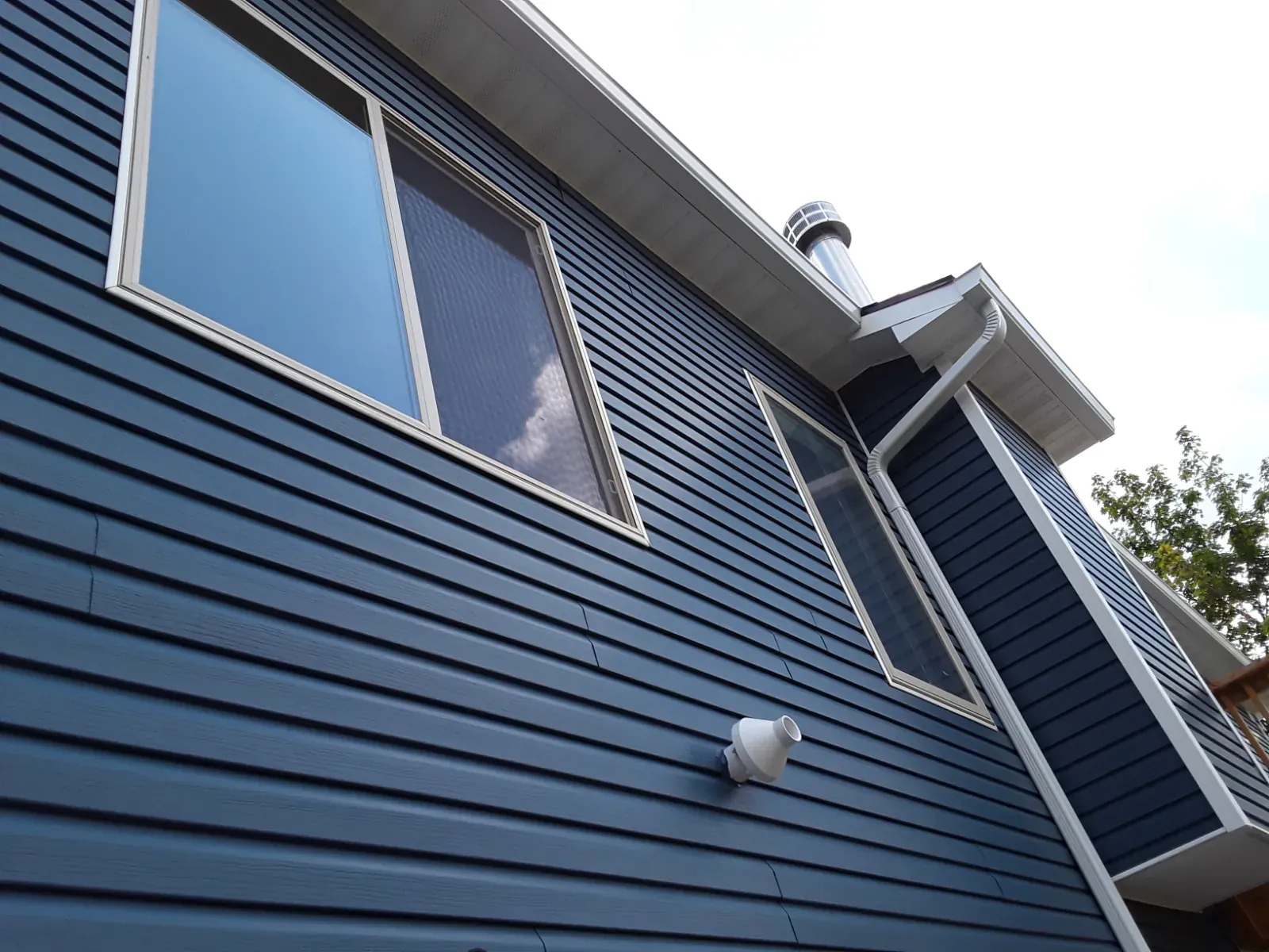 Blue lap siding with white trim